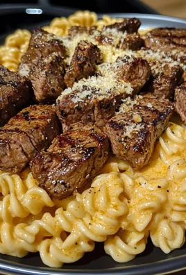 Cajun Garlic Butter Steak Tips with Cheesy Rotini Parmesan Sauce