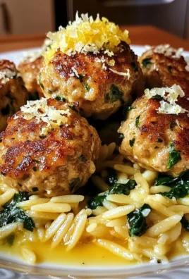 Lemony Chicken Ricotta Meatballs Over Garlic Spinach Orzo