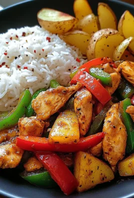 Spicy Garlic Chicken Stir-Fry with Peppers, Rice & Crispy Potato Wedges